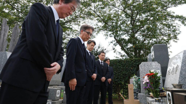 Japanese Police and Prosecutors Bow in Apology at Grave of Wrongfully Accused Businessman